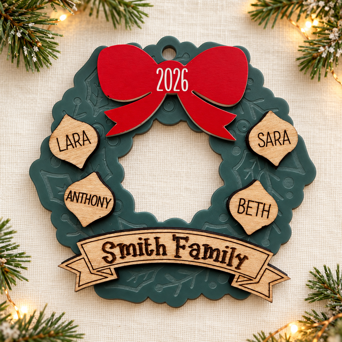 Gathered Together personalized family wreath ornament with red 2026 bow and wooden name accents on ivory linen with festive greenery and lights