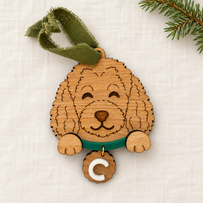 Wooden doodle dog ornament with green collar and personalized C initial tag