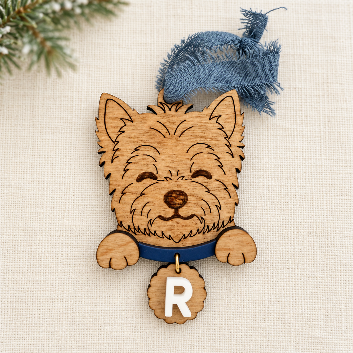 Wooden Yorkshire Terrier ornament with navy collar and personalized R initial tag